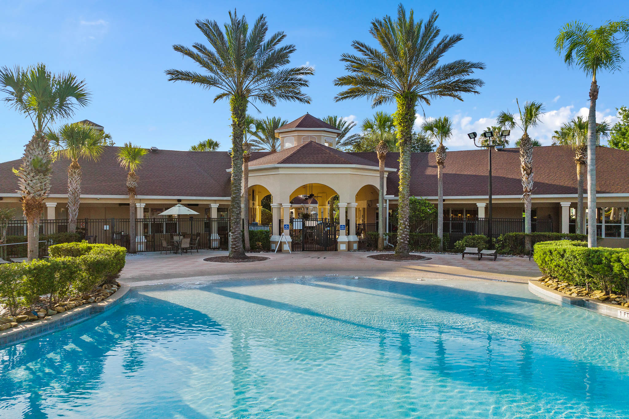 Windsor Hills Resort clubhouse and pool entrance framed by palm trees
