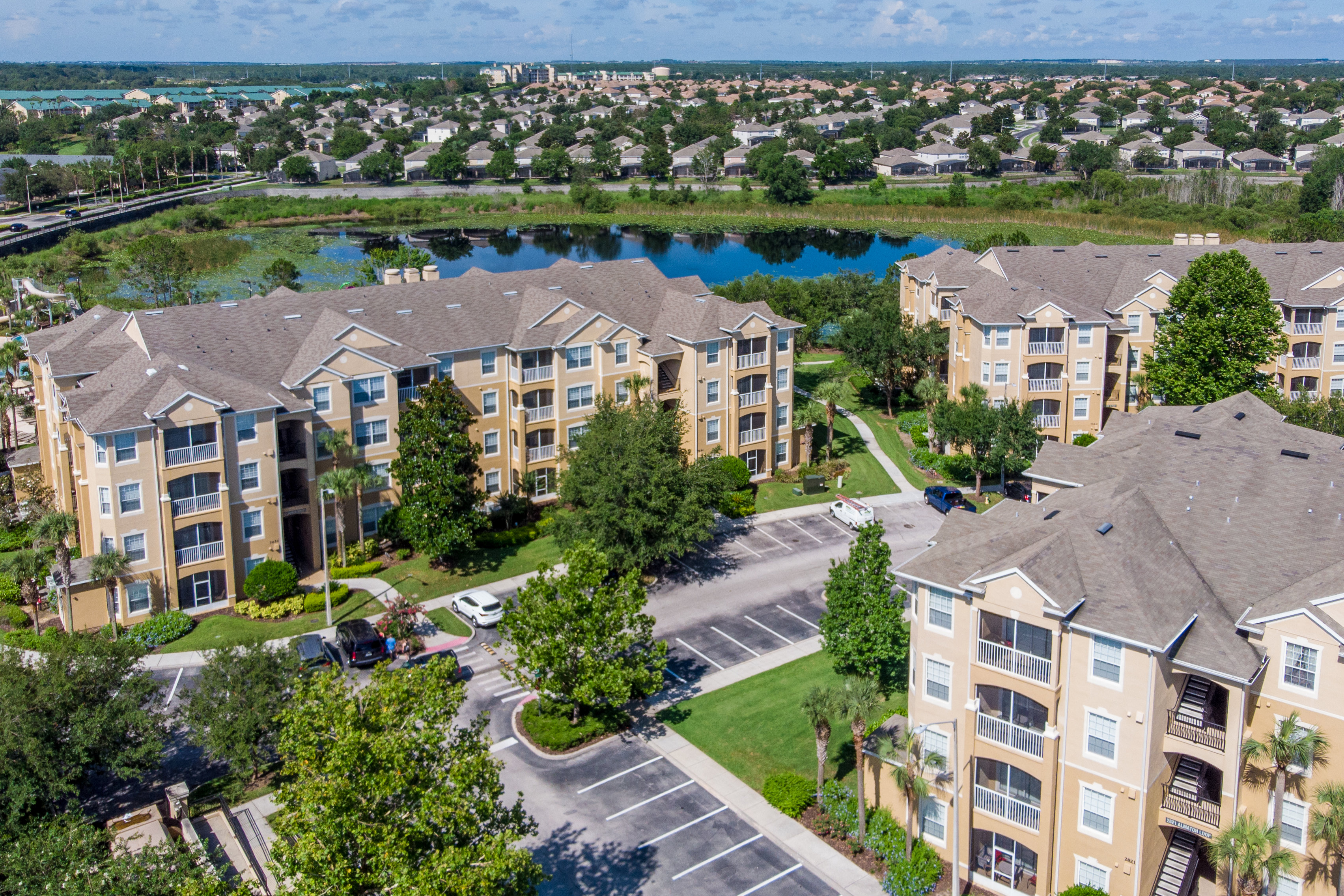 Aerial view of Windsor Hills Resort condo buildings beside a lake